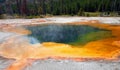 Hot steam rising off Emerald Pool hot spring in the Black Sand Geyser Basin in Yellowstone National Park in Wyoming USA Royalty Free Stock Photo