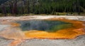 Hot steam rising off Emerald Pool hot spring in the Black Sand Geyser Basin in Yellowstone National Park in Wyoming USA Royalty Free Stock Photo