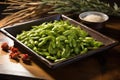 hot, steamed edamame arranged on rustic serving tray