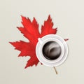 Hot steaming coffee in a white ceramic cup on a saucer and a bright red maple leaf. Autumn background. Vector realistic Royalty Free Stock Photo