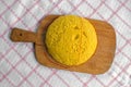 Hot steaming polenta on a old wooden board