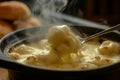 Hot, steamy fondue perfect for a chilly evening, with a generous cheese pull from the pot