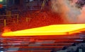 Hot steel on conveyor Royalty Free Stock Photo