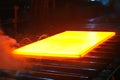 Hot steel on conveyor Royalty Free Stock Photo