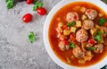 Hot stew tomato soup with meatballs and vegetables Royalty Free Stock Photo