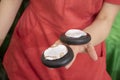 Hot stone manicure. Warm basalt stones are used for a luxurious hand massage relaxing neglected and overworked hands. Finish with Royalty Free Stock Photo