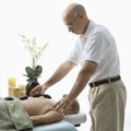 Hot stone massage. Royalty Free Stock Photo