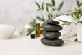 Hot stone massage - spa beauty treatment items on white wooden table Royalty Free Stock Photo