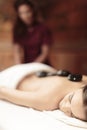 Hot stone massage therapy Royalty Free Stock Photo