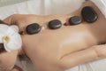 Hot stone massage therapy Royalty Free Stock Photo