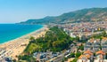 Hot summer day on Kleopatra Beach, cityscape of Alanya