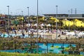 Water park on hot summer day people relax in and at pool Royalty Free Stock Photo