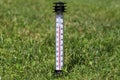 Hot summer. The thermometer in the grass