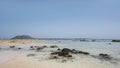 Hot summer views towards the small island of Los Lobos few miles north from Corralejo resort, Fuerteventura, Canary Islands, Spain Royalty Free Stock Photo