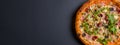 Hot tasty delicious rustic homemade american pizza over black background. Traditional Italian cuisine concept Royalty Free Stock Photo