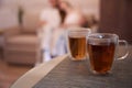 Hot tea is cooling down on the table in the room Royalty Free Stock Photo