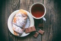 Hot tea with croissant and chocolate. Retro style image Royalty Free Stock Photo