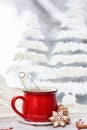 Hot tea cup with gingerbread cookies on a frosty winter background Royalty Free Stock Photo