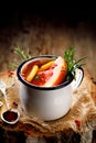 Hot Tea infusion with rosemary, grapefruit, lemon, red pepper and raspberry juice