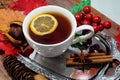 Hot tea with lemon in autumn and winter evenings - a festive table