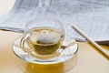 Hot tea, pencil and newspaper Royalty Free Stock Photo