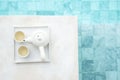 Hot tea pot near swimming pool in luxury hotel. Summer travel, vacation, holiday and weekend concept Royalty Free Stock Photo