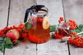 Hot tea from rosehip berries and fruit in transparent glasses and honey on a wooden table. Harvesting, autumn fall winter hot