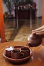 hot tea served using pottery with traditional sugar