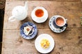 hot tea, tea cup and tea pot with carrot cake and mango cake with hot chocolate Royalty Free Stock Photo