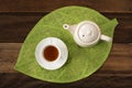 Hot tea and teapot on a table background