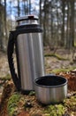 Hot tea in thermos for a walk in the woods Royalty Free Stock Photo