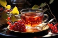 Hot tea from viburnum berries in a transparent cup. Vitamin drink to strengthen the immune system