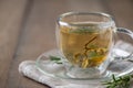 hot tea on wood table. Transparent cup of freshly brewed tea on wood table