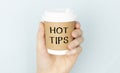 with Hot Tip on a cup of coffee on white Royalty Free Stock Photo