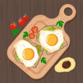 Hot toast with fried eggs and avocado, served with cherry tomatoes and parsley