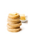 Hot toasted crumpets with butter slice isolated on white