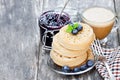 Hot toasted crumpets on the wooden table with blueberries and j Royalty Free Stock Photo