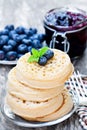 Hot toasted crumpets on the wooden table with blueberries and j Royalty Free Stock Photo