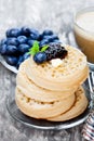 Hot toasted crumpets on the wooden table with blueberries and j Royalty Free Stock Photo