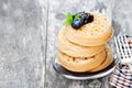 Hot toasted crumpets on the wooden table with blueberries and j Royalty Free Stock Photo