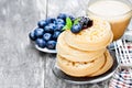 Hot toasted crumpets on the wooden table with blueberries and j Royalty Free Stock Photo