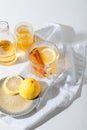 Hot Toddy cocktail drinks with lemon, honey and cinnamon stick in glass on white background Royalty Free Stock Photo