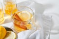 Hot Toddy cocktail drinks with lemon, honey and cinnamon stick in glass on white background Royalty Free Stock Photo