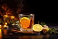 Hot toddy - hot whiskey with lemon, honey and spices. On a dark background.