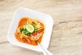 Hot Tom Yum Noodles on Vintage Wooden Background