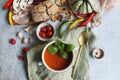 Hot tomato soup with vegetables and crispy bread Royalty Free Stock Photo