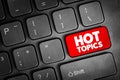 Hot Topics text button on keyboard, concept background Royalty Free Stock Photo