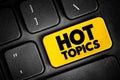 Hot Topics text button on keyboard, concept background Royalty Free Stock Photo