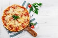 Hot true PEPPERONI ITALIAN PIZZA with salami and cheese. TOP VIEW Tasty traditional pepperoni pizza on board on white wooden table Royalty Free Stock Photo
