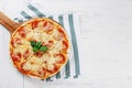 Hot true PEPPERONI ITALIAN PIZZA with salami and cheese. TOP VIEW Tasty traditional pepperoni pizza on board on white wooden table Royalty Free Stock Photo